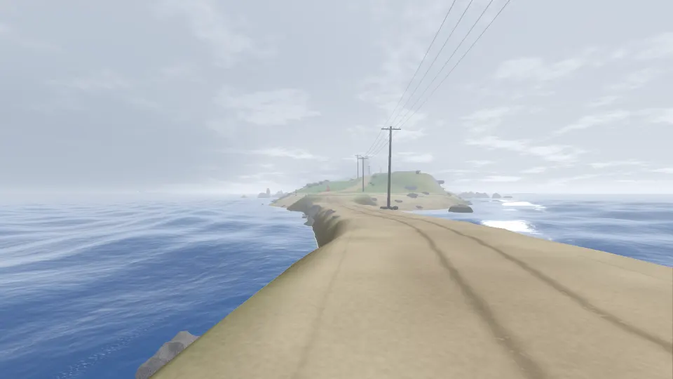 The causeway in sea fog at low tide, the island ahead fading into grey, the telephone poles going out into the mist.